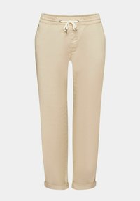 Pantalon décontracté beige avec taille élastique et cordon blanc, coupe droite avec ourlets retroussés.