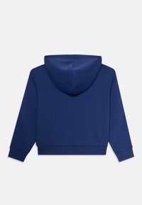 Haut à capuche bleu marine avec de longues manches et une grande capuche, présenté de dos sur un fond blanc uni.