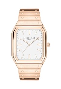 Rosaguldig oktagonal klocka med en vit urtavla, minimala timmarkörer och ett slätt metallband med prickaccentuer och ett säkert spänne.