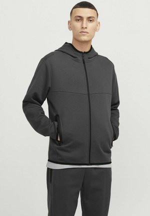 Donkergrijze zip-up hoodie met een capuchon, naadloos ontwerp en zijvakjes. Gemaakt van zachte stof met een gladde textuur en contrasterende trimdetails.