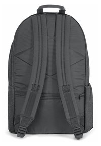Gray fabric backpack with padded back, adjustable straps, and a side pocket. Smooth texture with reinforced stitching and a top handle.