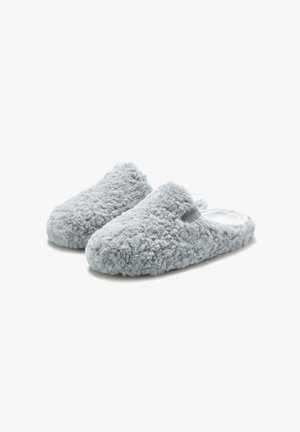 Gray, fluffy slippers with a textured fabric, open back, and a small logo tag on the side; soft, plush material for comfort.