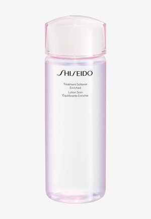 Bouteille en plastique transparent avec un bouchon rose pâle étiquetée Shiseido Treatment Softener Enriched lotion.