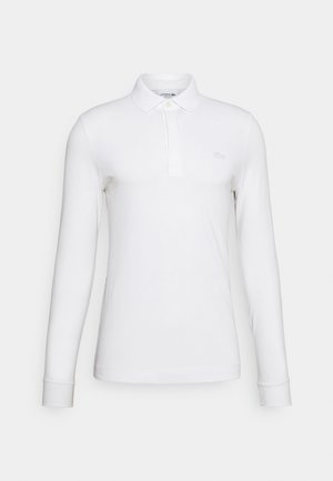 Polo bianco a maniche lunghe realizzato in cotone, con colletto classico, apertura a due bottoni e ricamo del logo discreto sul petto.