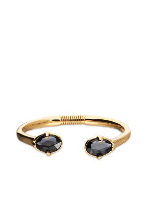 Bracelet manchette ton or avec deux pierres précieuses ovales noires, finition lisse et un centre torsadé pour plus de flexibilité.