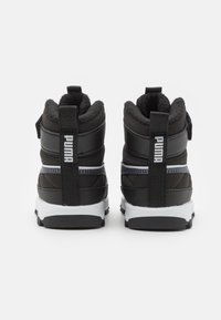 Black high-top sneakers with a padded collar, textured surface, white sole, and contrasting blue stripe. Features a pull tab and branding.