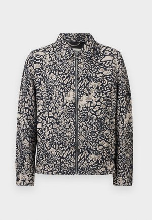 Veste zippée à manches longues avec col, présentant un motif abstrait animalier en noir et beige.