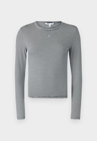 Långärmad, rundhalsad topp i svart och vita ränder. Har en liten logotyp på bröstet och är tillverkad av ett mjukt, stretchigt material.