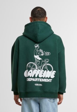 Green hoodie featuring a large white graphic on the back of a cyclist holding a coffee cup, with text "CAFFEINE DEPARTEMENT." Soft texture.