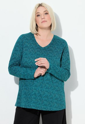 Teal, long-sleeve top with a V-neck, featuring a textured pattern. Soft material, relaxed fit, no visible hardware or accents.