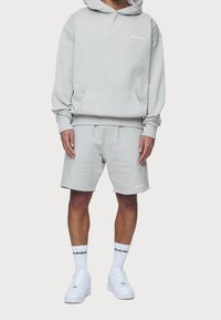 Pegador Jersey con capucha - light grey