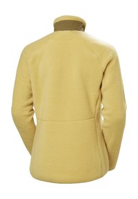 Geel fleecjack met hoge kraag, gestructureerd oppervlak, raglanmouwen en platte naden, met een contrasterende tan neklijn.
