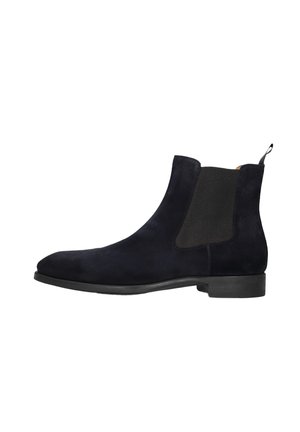 Navy blue suede chelsea boots with black elastic side panels, rounded toe, and a pull tab at the back, set on a flat rubber sole.