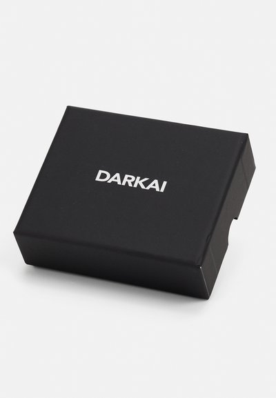 Black rectangular box with a smooth matte finish. Features the word "DARKAI" in bold white lettering on the front.