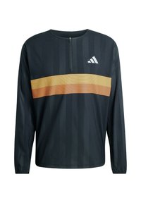 Black athletic long-sleeve top with a quarter zip, featuring a horizontal orange striped pattern across the chest and vertical ribbed texture.