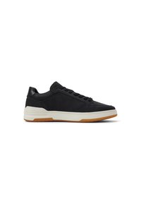 Zapatillas negras de cuero con una textura suave, con una mediasuela blanca y suela de goma. Diseñadas con cierre de cordones y sutiles acentos.