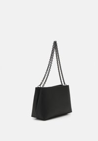 Black shoulder bag with a smooth texture, featuring two chain straps and a structured, rectangular shape. Simple design, no additional hardware.
