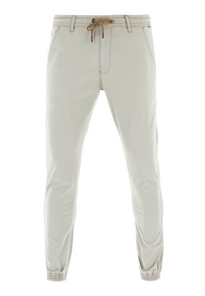 Helle beige Jogginghosen mit elastischem Bund und Kordelzug, ausgestattet mit Bündchen an den Knöcheln und Seitentaschen für Funktionalität.