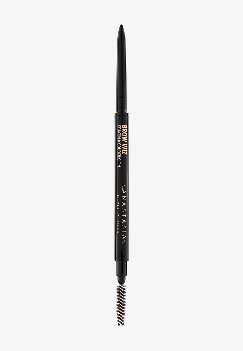 Black brow pencil with a fine tip and retractable mechanism. Features a spoolie brush on one end for grooming. Label reads "BROW WIZ."