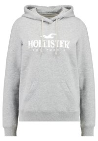 Grå huvtröja med en framficka, dragsko på huvan och "Hollister California" tryckt i vitt med blommönster.