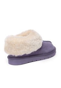 Purple slipper with a soft cream faux fur cuff, flat outsole, and simple design. Suede-like material, providing a cozy texture.