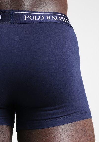 Marineblauwe boxershorts met een gladde textuur, voorzien van een contrasterende witte tailleband met "POLO RALPH LAUREN". Strakke pasvorm.