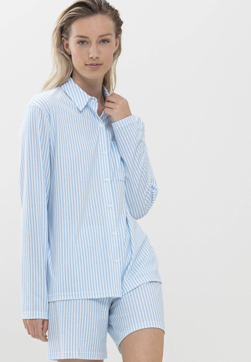 Light blue and white striped pajama set featuring a button-up long-sleeve shirt and matching shorts, made from soft fabric.