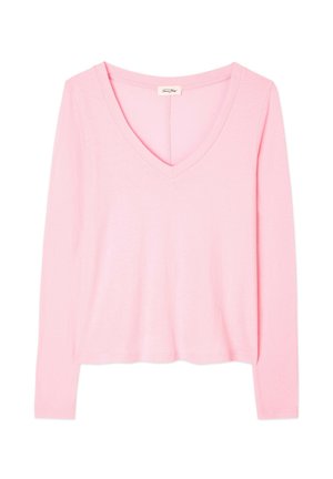 Ilgų rankovių, V formos iškirptės šviesiai rožinė palaidinė, pagaminta iš minkštos medžiagos su laisvu siluetu. Paprastas dizainas, be matomų raštų ar akcentų.