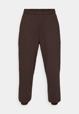 Pantaloni della tuta marrone scuro realizzati in morbido tessuto, dotati di una vita elastica e polsini elasticizzati alle caviglie. Design minimalista senza motivi.