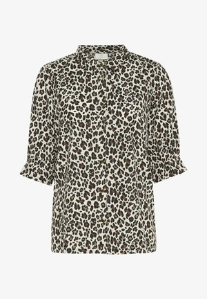 Srajca s krompirjem v leopardjem vzorcu na mehkem beigem ozadju, z črnimi in rjavimi pikami, s tremi četrtinami rokavi in klasičnim ovratnikom.