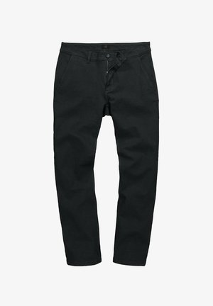 Mustat housut, joissa on puuvillasekoitetta, vetoketjuluukku, nappisulku ja tavalliset taskut. Sileä rakenne ja slim fit -tyyli.