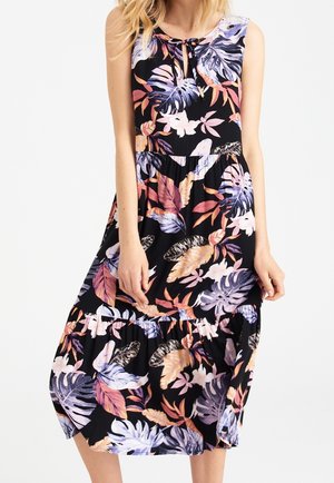 Robe noire sans manches avec jupe à volants, ornée d'un motif de feuilles tropicales violettes, orange et blanches, avec un petit décolleté goutte d'eau à lien noué.