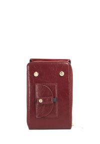 Red leather zippered wallet with a front pocket, gold hardware accents, textured finish, and rounded edges. Compact rectangular design.