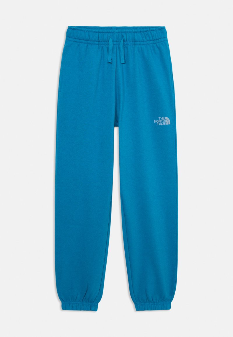 Tirkīza krāsas sporta bikses ar elastīgu jostasvīru un regulējamu auklu. Raksturīgas sašaurināta kāja un mazs drukāts logotips augšstilbā.