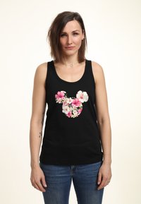 Canotta nera senza maniche caratterizzata da una silhouette floreale di Topolino in fiori rosa e bianchi, con foglie verdi. Vestibilità casual.