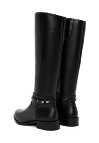 Knee-high black leather boots with a smooth texture, slim design, decorative strap with hardware accents, and a low heel.