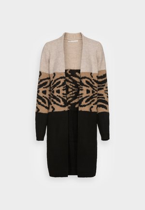 Long cardigan en tricot ouvert sur le devant, beige, marron et noir avec des motifs noirs abstraits sur la partie centrale et des manches longues.