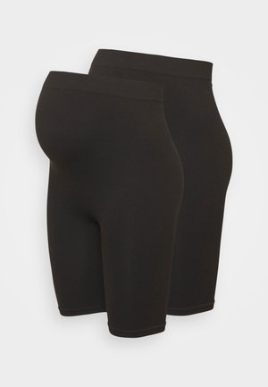 Shorts noirs côtelés taille haute, avec une ceinture élastique, longueur genoux, texture lisse, conçus pour le confort et le soutien, sans ornements.