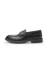 Mocasines de cuero negro con punta redondeada, costura decorativa y una costura elevada. Cuentan con una suela de goma plana y una textura suave.