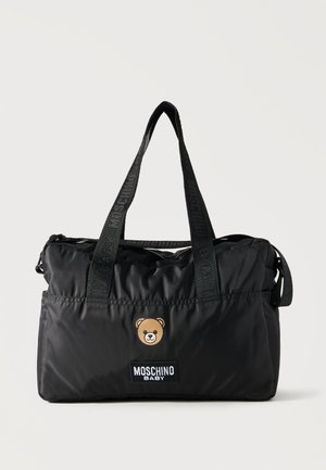 Black Moschino Baby tote bag with dual handles, teddy bear face logo, and front patch with brand name on plain background.