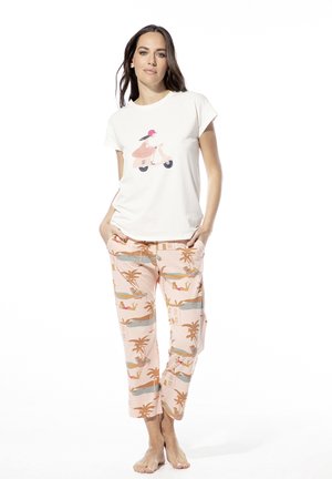 Baumwoll-T-Shirt in Creme mit einem Roller-Motiv. Rosa Schlafanzughosen mit Palmen- und Strandmotiven. Bequemer Schnitt; leichte Materialqualität.