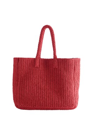 Sac cabas en tricot rouge avec deux anses, forme rectangulaire et motif côtelé vertical texturé, sur fond blanc.