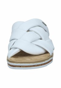 White braided slide sandal with a soft leather upper, cork footbed, and a textured outsole. Features minimal hardware accents.