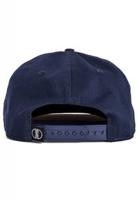 Navy blue cap with a smooth fabric texture. Features a plastic adjustable strap and stitched ventilation holes on the back.