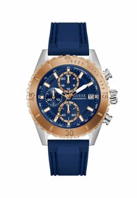 Montre chronographe pour homme avec un cadran bleu, des accents en or rose et un bracelet en caoutchouc bleu. Elle présente trois sous-cadrans et un affichage de la date.