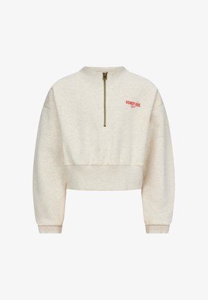 Crèmekleurige cropped sweatshirt met een hoge kraag en gouden rits. Voorzien van rode tekst "HOWDY GIRL" op de voorkant. Zachte textuur.