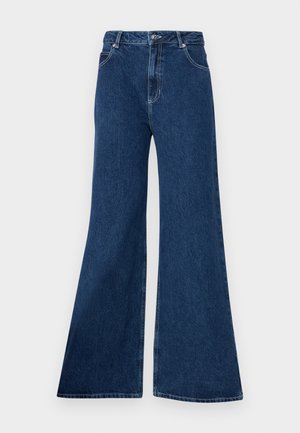 Flared blue jeans made of denim, featuring a high waist, five-pocket design, contrasting stitching, and a zip fly with a button closure.