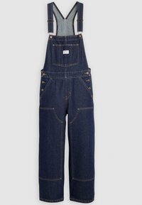 Unos monos de mezclilla azul oscuro con tirantes ajustables, bolsillo en el pecho frontal, botones laterales y grandes bolsillos parches en las piernas.