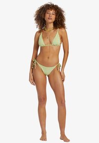 Green plaid bikini set featuring a triangular top and adjustable tie-side bottoms, made from a lightweight, textured fabric.