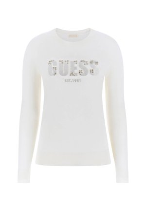 Maglione bianco a maniche lunghe con polsini e orlo a costine, decorato con "GUESS" in strass e "EST. 1981" stampato sotto.